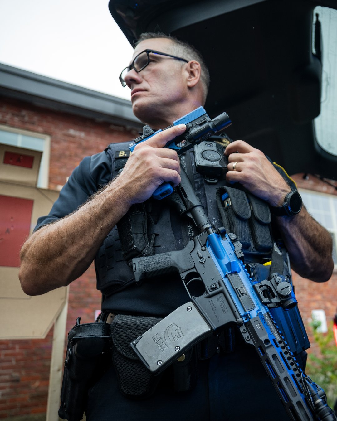 Operators clearing a room with UNIT4 training rifles